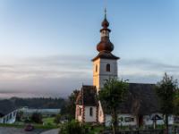 Erste Sonnenstrahlen an der Kirche von Velden-Kranzlhofen - Velden am Wörthersee